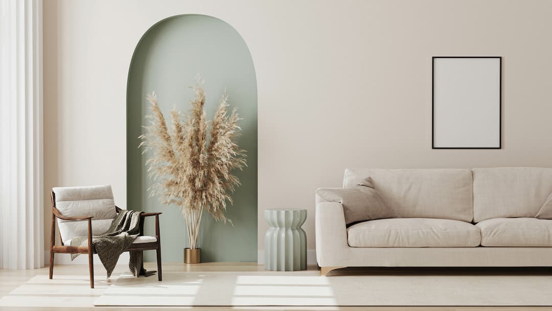 Interior design, room with beige features and sage feature wall with pampas grass